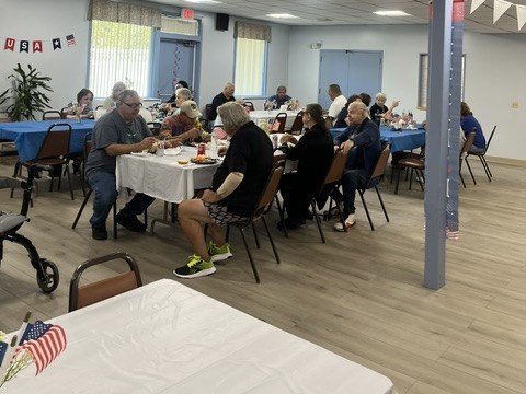 Group of seniors at tables at the Patriot Luncheon