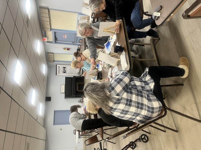 Group of seniors painting